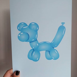May include: A light blue print featuring a balloon animal dog. The dog is rendered in a glossy, three-dimensional style, with highlights and shadows. The artwork is set against a pale blue background.