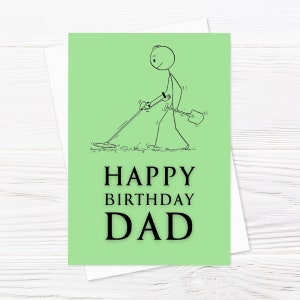 May include: A green card with a stick figure illustration of a person holding a metal detector and a shovel. The text "HAPPY BIRTHDAY DAD" is printed in black.