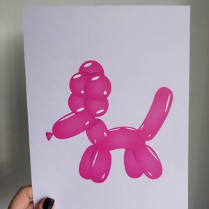 May include: A print of a pink balloon dog. The dog is made of connected balloon shapes, with a head of round balloons and a long, curved tail. The artwork is on a white background.