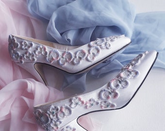 Bridal Wedding Shoes in soft white satin, classical high heel with pastel coloured guipure lace embroidery, made in the UK .