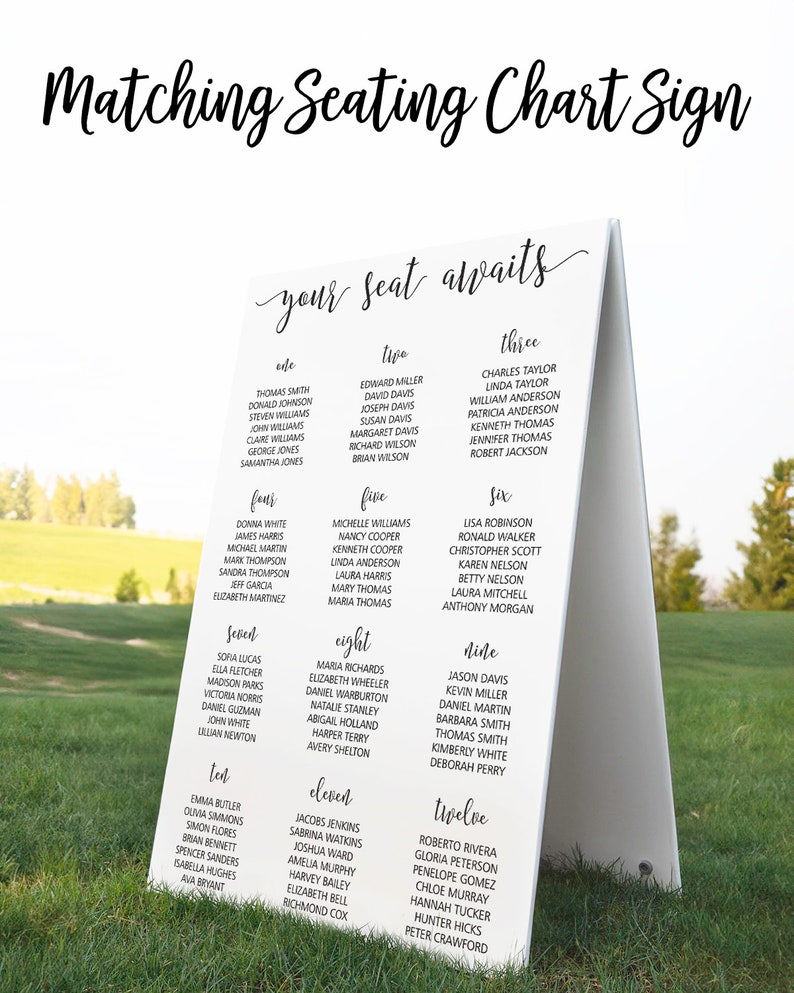 May include: White sign with black text, titled "Matching Seating Chart Sign" with the words "your seat awaits" in cursive. The sign lists names for a wedding reception seating chart, with table numbers one through twelve.