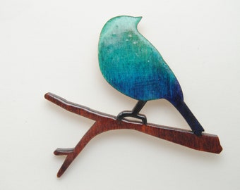 Oiseau sur branche, broche bleu