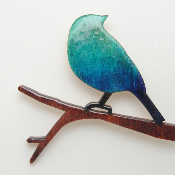 Oiseau sur branche, broche bleu