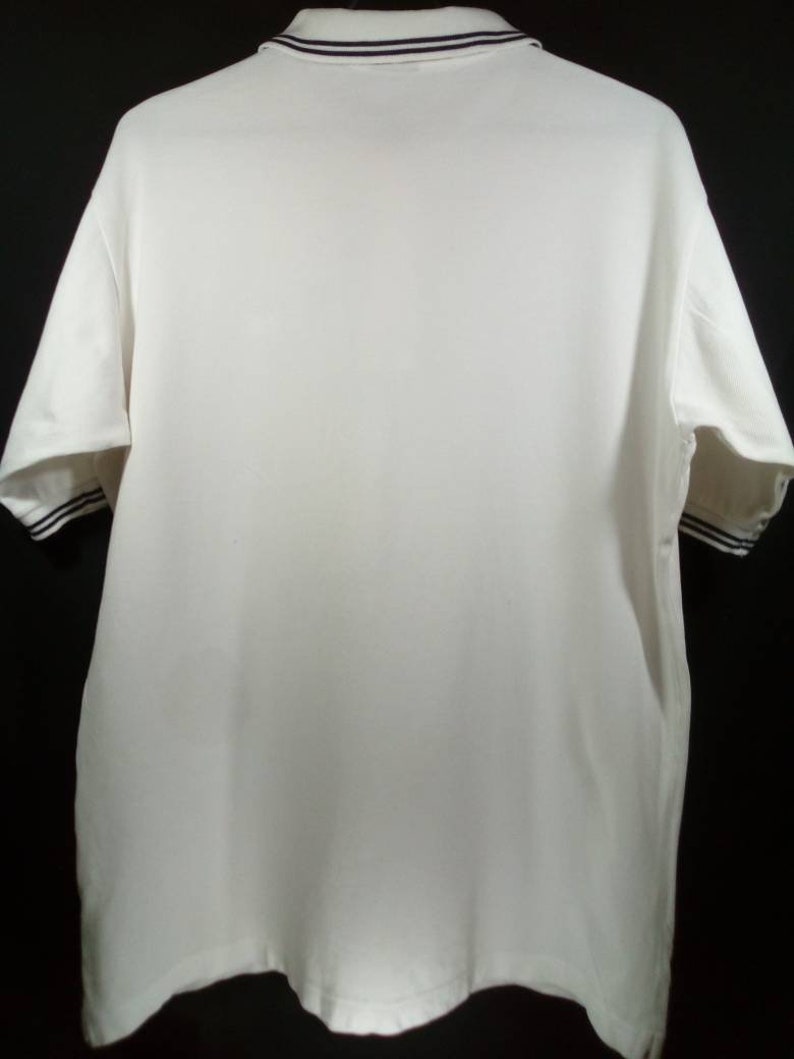 Vintage Keith Haring X uniqlo polo tee