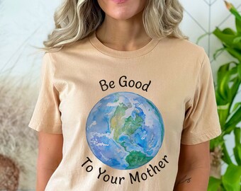 May include: A tan t-shirt with a watercolor illustration of the Earth and the text "Be Good To Your Mother".