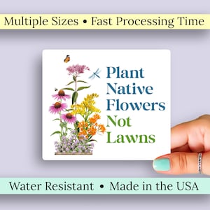 May include: A square white sticker with the text "Plant Native Flowers Not Lawns" in blue and green. The sticker features illustrations of various colorful wildflowers and a butterfly. The text "Multiple Sizes" and "Made in the USA" are also present.