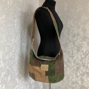 May include: A handmade, wooden cutting board with a natural wood grain. The board is rectangular with rounded corners and a juice groove. It measures approximately 18 inches long, 12 inches wide, and 1 inch thick.