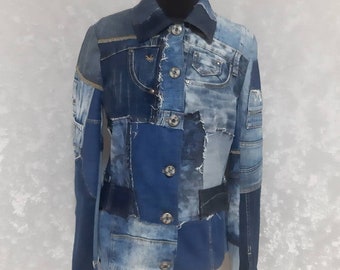 May include: A blue denim jacket made from patchwork pieces of different shades of blue denim. The jacket has a button-up front and long sleeves.