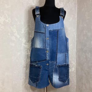 Handmade denim patchwork overalls, Casual short overalls of shabby jeans, Oversize denim overalls in hipster style