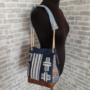 Handmade hobo denim bag made from recycled jeans and leather in ethnic style
