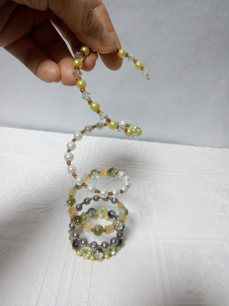 Spiral boho multi-row bracelet for hippies festival and beach party on a wire with a memory of beads and crystals Trend summer 2019