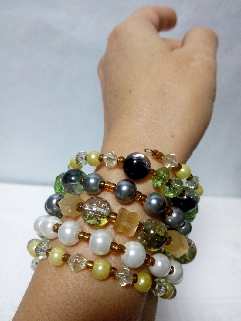 Spiral boho multi-row bracelet for hippies festival and beach party on a wire with a memory of beads and crystals Trend summer 2019