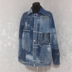 May include: A blue denim jacket made from patchwork denim with frayed edges and multiple pockets.