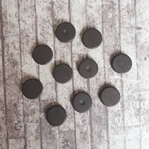 May include: Ten round black magnets with a hole in the center of some of them.