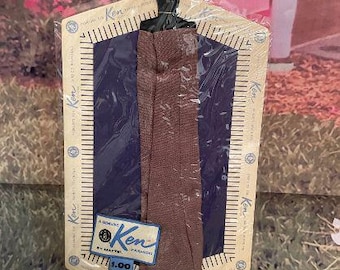 Vintage 1962 Ken Doll Clothes Fashion Pak Brown Pants NEVER REMOVED from Package w/ 1960s booklet on back, sealed.