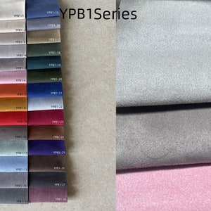 Peut inclure: Un nuancier de tissus pr&eacute;sentant une vari&eacute;t&eacute; de couleurs, notamment beige, gris, rose, orange, rouge et bleu. Le texte "YPB1Series" est visible. Les &eacute;chantillons sont dispos&eacute;s en rang&eacute;es verticales, avec des codes pour chaque couleur.