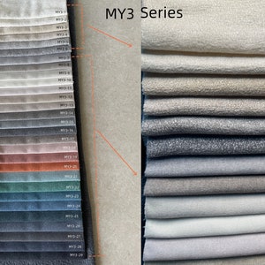 May include: Fabric swatch samples from the MY3 Series, showcasing a range of colors and textures. The swatches include shades of beige, gray, and blue, with a variety of fabric finishes. The image displays a color palette for upholstery or textile design.