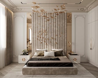 May include: A luxurious bedroom with a large bed featuring a tufted headboard with gold accents. The bed is dressed in white linens and has a brown throw blanket. There are two nightstands with gold accents on either side of the bed. The room is decorated in a modern style with white walls and gold accents.