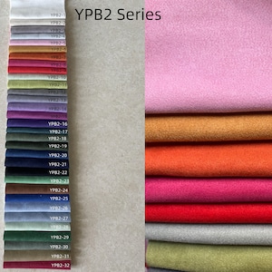 May include: A fabric swatch display featuring the "YPB2 Series" with a variety of colors. The display includes a spectrum of hues, from light pink and orange to deep blues and greens. The text "YPB2 Series" is visible.