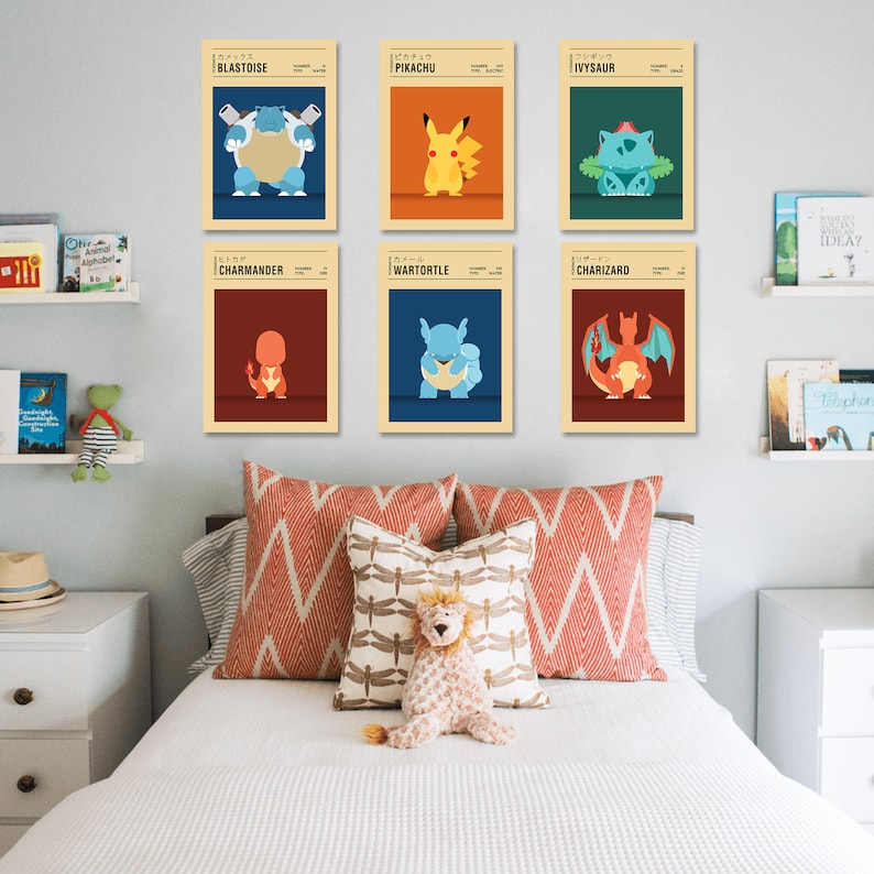May include: Six vintage-style posters featuring Pokemon characters. The posters are in a grid formation on a white wall. The characters are Blastoise, Pikachu, Ivysaur, Charmander, Wartortle, and Charizard.