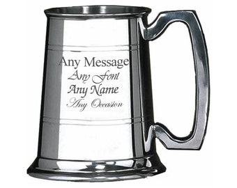 May include: A silver pewter tankard with a handle. The tankard is engraved with the text "Any Message Any Font Any Name Any Occasion".