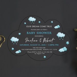 May include: A blue and white baby shower invitation with a cloud design. The invitation says "Our dream come true. Please join us for a baby shower honoring Pauline & Robert. Saturday, August 31, 202X | 1:30PM-7PM. The Fox Hollow. 1043 Northern Boulevard, Roslyn, N.Y. 11576. Please RSVP to Stella at 123-456-789 by August 17th."