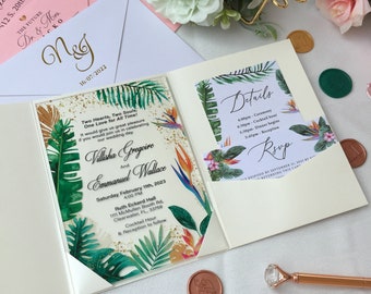 May include: A tropical-themed wedding invitation with a white background and a green, orange, and yellow floral design. The invitation includes the names Villisha Gregoire and Emmanuel Wallace, the date Saturday February 11th, 2023, and the time 4:00 PM. The invitation also includes the location Ruth Eckerd Hall, 1111 McMullen Booth Rd, Clearwater, FL, 33759. The invitation also includes the details of the wedding ceremony, cocktail hour, dinner, and reception. The invitation also includes an RSVP card.