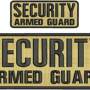 May include: Two tan and black embroidered patches that read "SECURITY ARMED GUARD". The larger patch is rectangular and the smaller patch is square.
