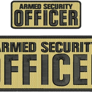 May include: Two beige patches with black embroidered text. The top patch reads "ARMED SECURITY OFFICER". The bottom patch is larger and reads "ARMED SECURITY OFFICER".