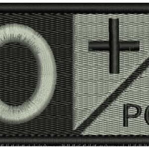 May include: A black and white embroidered patch with the letters "O+ POS" in white. The "O" is a circle and the "+" is a cross.