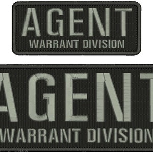 May include: Two black embroidered patches with white text. The top patch reads "AGENT WARRANT DIVISION". The bottom patch reads "AGENT WARRANT DIVISION".
