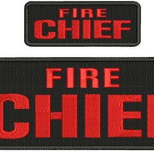 May include: Two black embroidered patches with red lettering. The larger patch reads "FIRE CHIEF" in large letters. The smaller patch reads "FIRE CHIEF" in smaller letters.