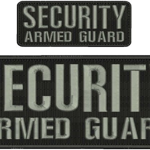 May include: Two black and grey embroidered patches with white text. The top patch reads "SECURITY ARMED GUARD". The bottom patch reads "SECURITY ARMED GUARD".