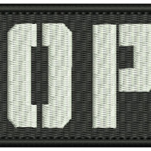 May include: A black patch with the word "BOPE" embroidered in white.