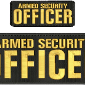 May include: Two black patches with gold embroidered text. The larger patch reads "ARMED SECURITY OFFICER". The smaller patch reads "ARMED SECURITY OFFICER".