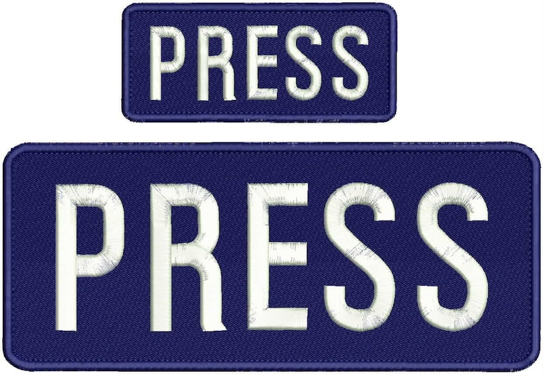 Pode incluir: Dois patches de tecido azul com texto bordado branco que diz "PRESS". O patch maior &eacute; retangular e o menor &eacute; quadrado.