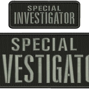May include: Two black embroidered patches with white text that reads "SPECIAL INVESTIGATOR". The top patch is smaller than the bottom patch.