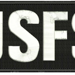USFS Broderilapp 10x25 cm med vita bokstäver och krokar baktill