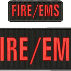 May include: Two black rectangular patches with red embroidered text. The top patch reads "FIRE/EMS" in all caps. The bottom patch is larger and reads "FIRE/EMS" in all caps.