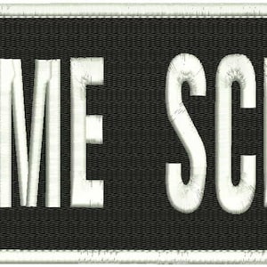 May include: White "CRIME SCENE" text on a black rectangular patch.