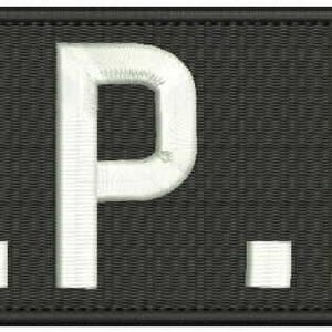 May include: Embroidered patch with the letters "R.P.D." in white, stitched onto a black rectangular background. The patch has a textured appearance and a black border.