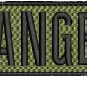 May include: Embroidered patch with the word "RANGER" in bold, black letters. The patch has a rectangular shape with rounded corners and a green background. The border is black.