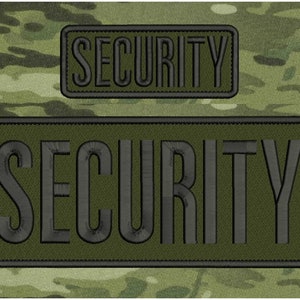 Peut inclure: Deux patchs brodés vert et noir avec le mot "SECURITY" en lettres noires.