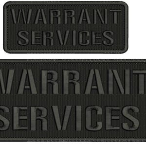 May include: Two black embroidered patches with the text "WARRANT SERVICES" in white lettering. The larger patch is rectangular and the smaller patch is a narrow rectangle.