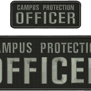 May include: Two black embroidered patches with the text "CAMPUS PROTECTION OFFICER". The larger patch is rectangular, and the smaller patch is a smaller rectangle. The text is in a light gray color.