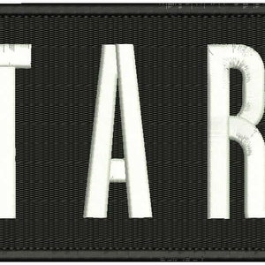 May include: Embroidered patch with the word "STARS" in white, block letters. The text is stitched onto a black rectangular background with a black border. The letters have a textured, vintage appearance.