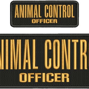 May include: Two black embroidered patches with gold lettering. The larger patch reads "ANIMAL CONTROL OFFICER" in bold, block letters. A smaller patch above repeats the same text. Ideal for uniforms or gear.
