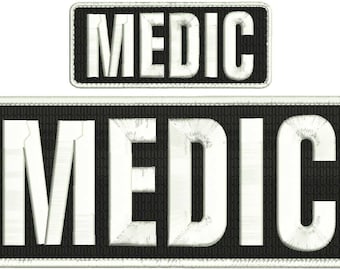 May include: Two black and white embroidered patches with the word "MEDIC" in white lettering.