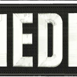 Op de afbeelding: Witte tekst op een zwarte achtergrond met de tekst "MEDIC".