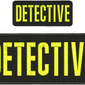 May include: Two black fabric patches with the word "DETECTIVE" embroidered in yellow.